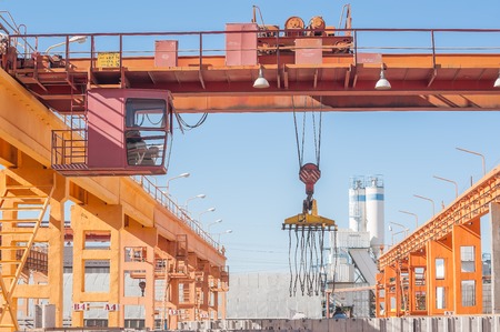 Tyumen, Russia - August 13, 2013  Finished goods warehouse at Concrete Goods Plant No  5  The crane operator working outdoorsのeditorial素材
