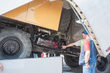 Tyumen, Russia - August 11, 2012  Air show  On a visit at UTair  in heliport Plehanovo  Truck  Ural  loading in MI-26T helicopterのeditorial素材