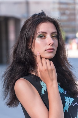 Fashion style photo of beautiful woman at urban backgroundの写真素材