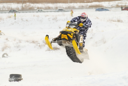 Tyumen, Russia - December 26. 2009: Sport snowmobile racing on championship of Ural region. Snowmobile jumpのeditorial素材
