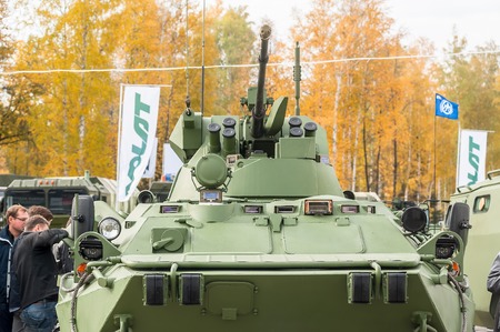 Nizhniy Tagil, Russia - September 25. 2013: Visitors explore military equipment on exhibition range....