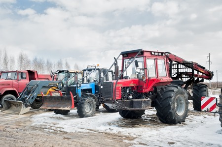 Tyumen, Russia - April 04. 2014: IV Tyumen specialized exhibition Agricultural Machinery and Equipment. Tractors and truck stand on open areaのeditorial素材