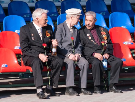 Tyumen, Russia - May 9. 2009: Victory Day in Tyumen. Senior veterans of World War II on tribune...