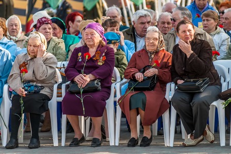 Tyumen, Russia - May 9. 2009: Victory Day in Tyumen. Senior female veterans of World War II meet on tribunes waiting for paradeのeditorial素材
