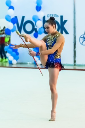 Tyumen, Russia - April 4, 2015: All-Russian competitions in rhythmic gymnastics "Spring grace". Sports complex "Priboy". Young pretty girl shows own skill in exercise with ballのeditorial素材