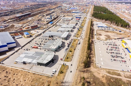Tyumen, Russia - April 26, 2015: Aerial view on group of car shops so called autograd. Respubliki street passes into federal highway Tyumen-Omskのeditorial素材