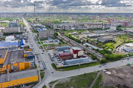 Tyumen Russia May 19 2015: Aerial view on Permyakova and Harkovskaya streets intersection. On foreground: Ochakovo factory Perestroyka trade center Construction yard shopの写真素材