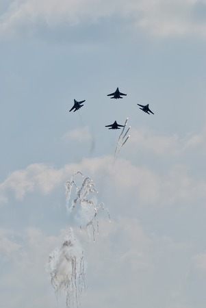 Nizhniy Tagil, Russia - July 12. 2008: Group of aviafighters SU-27, let out thermal traps against rockets. Russia Arms Expo-2013のeditorial素材