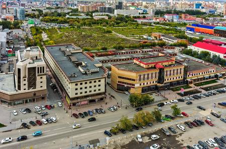 Tyumen, Russia - August 25, 2015: Demidov stan office buildings and waste ground on place of demolished machine-tool factory. Maxima Gorkogo streetのeditorial素材