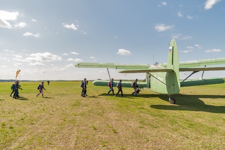 Yalutorovsk, Russia - May 24, 2008: Group of athletes-paratroopers gets into AN-2 plane. Sport...