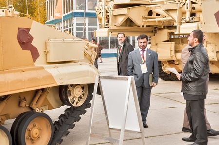 Nizhniy Tagil, Russia - September 25. 2013: Representative of foreign delegation studies tank T-72....