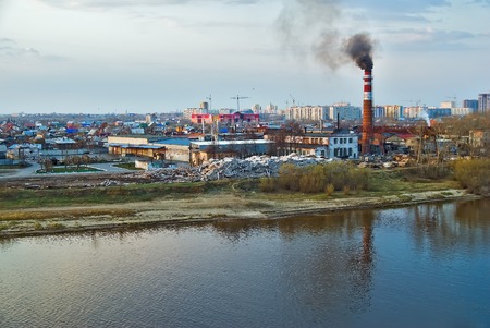 Tyumen, Russia - May 6, 2008: Plywood factory on river bank. Now it is transferred to industrial zone of suburb, and buildings are demolishedの写真素材