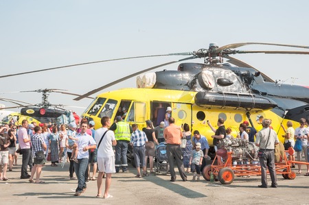 Tyumen, Russia - August 11, 2012: Air show On a visit at UTair in heliport Plehanovo. People explore the MI-10K  helicopterのeditorial素材