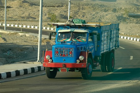 Hurghada, Egypt - November 13, 2006: Old truck driven by arabian driver moves on intercity roadのeditorial素材