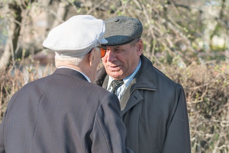 Tyumen, Russia - May 9. 2009: Victory Day in Tyumen. Two senior veterans of World War II meet on street before paradeのeditorial素材