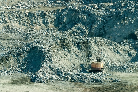 Sunny ambiance with resting digger in stone pit. Sverdlovsk region. Russiaの写真素材