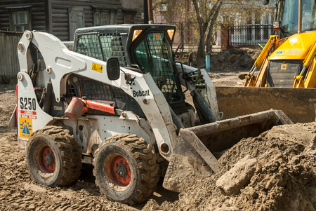 Tyumen, Russia - May 5, 2007:  skid loader working on road construction