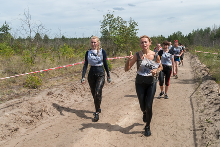 Tyumen, Russia - June 11, 2016: Race of Heroes project on the ground of the highest military and engineering school. Sportsmen run between stagesのeditorial素材