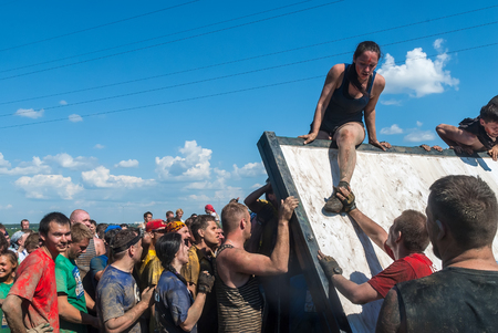 Tyumen, Russia - July 9, 2016: Steel Character extrim race on Voronino Hill. Athletes climb on inclined wallのeditorial素材
