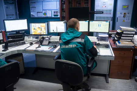 Tobolsk, Russia - July 15. 2016: Sibur company. Central control panel of Tobolsk Polymer plant. The engineering personnel watch in monitors work of the equipmentのeditorial素材