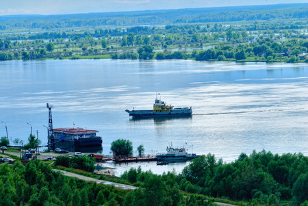Little ferry is transported through Irtysh riverの写真素材