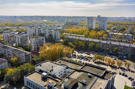 Tyumen, Russia - September 27, 2016: Aerial view on Builder palace of culture and sleeping neighborhood large-panel houses, so called KPD. Respubliki streetのeditorial素材