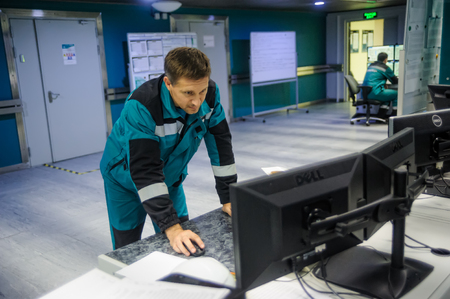 Tobolsk, Russia - July 15. 2016: Sibur company. Central control panel of Tobolsk Polymer plant. The engineering personnel watch in monitors work of the equipmentのeditorial素材