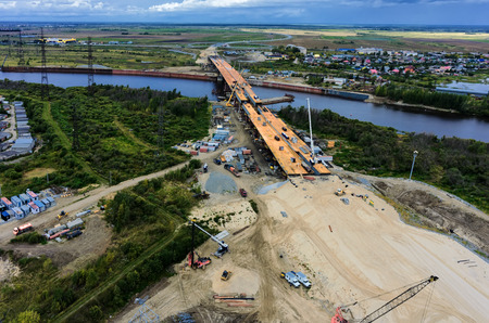 Tyumen, Russia - August 29, 2015: Construction of East Round bridge through Tura Riverのeditorial素材