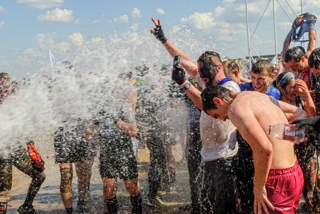 Tyumen, Russia - July 9, 2016: Steel Character extrim race on Voronino Hill. Athletes are watered after the end of a raceのeditorial素材
