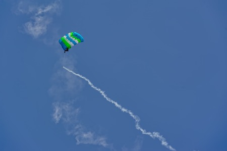 Tyumen, Russia - August 11, 2012: On a visit at UTair air show in heliport Plehanovo. Paratrooper man landing in show programのeditorial素材