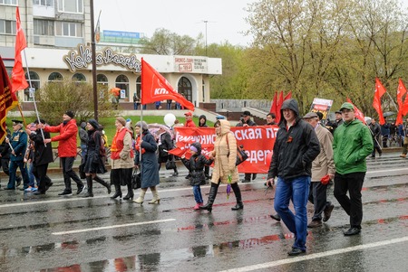 Tyumen, Russia - May 9. 2015: Parade of Victory Day in Tyumen. Members of Commubist Party of Russian Federation on paradeのeditorial素材