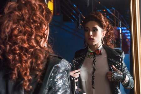 Tyumen, Russia - April 16, 2014: Competition of young performers the Song knows no limit in dramatic theater. Girl prepares for a part behind the scenesのeditorial素材