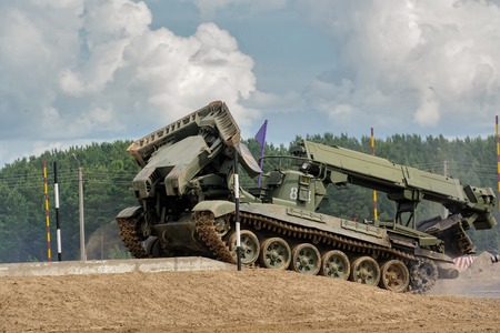 Tyumen, Russia - June 21, 2017: Army Games. Safe Route contest. Recovery of road part for column moving by IMR-2 combat engineer vehicleのeditorial素材