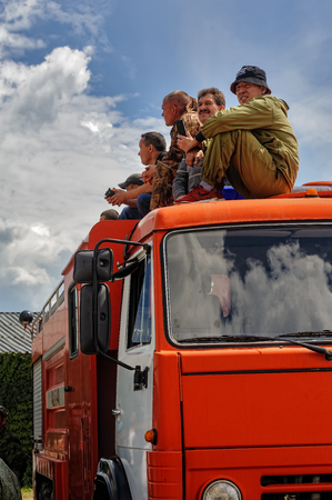 Tyumen, Russia - June 21, 2017: Army Games. Safe Route contest. Viewers on fireguard vehicleのeditorial素材