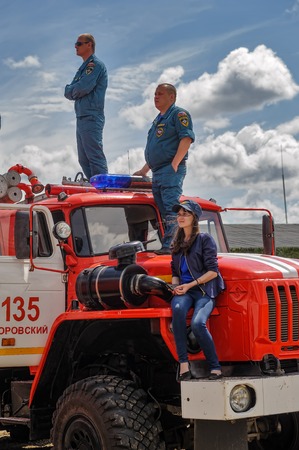 Tyumen, Russia - June 21, 2017: Army Games. Safe Route contest. Viewers on fireguard vehicleのeditorial素材