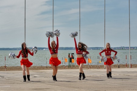 Tyumen, Russia - June 23, 2017: Army Games. Engineering Formula contest. Highest military and engineering school ground. Group of young girls cheerleaderのeditorial素材