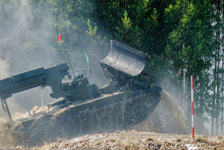 Tyumen, Russia - June 23, 2017: Army Games. Engineering Formula contest. Highest military and engineering school ground. Speed motion of IMR-2 combat engineer vehicle and overcoming fordのeditorial素材