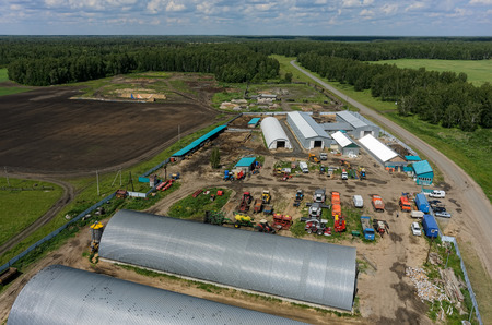 Verhovina, Russia - June 14, 2017: Aerial view onto modern machine yard of agricultural firm. Sverdlovsk regionのeditorial素材