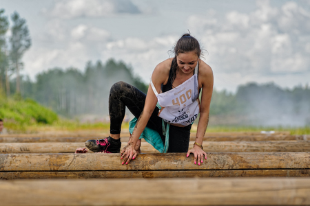 Tyumen, Russia - July 1, 2017: Race of Heroes project on the ground of the highest military and engineering school. The girl performs exercise the Wellのeditorial素材