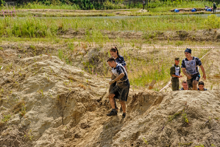 Tyumen, Russia - July 1, 2017: Race of Heroes project on the ground of the highest military and engineering school. . Athletes run between stagesのeditorial素材