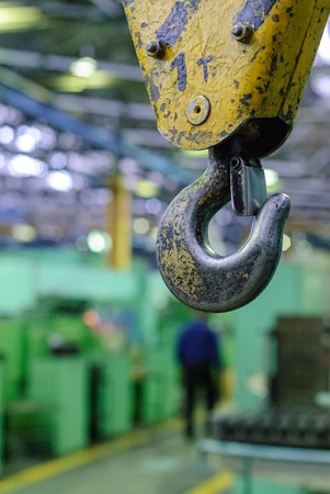 Metallic industrial hook for lifting heavy thing in the factoryの写真素材