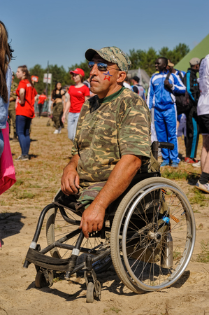 Tyumen, Russia - July 1, 2017: Race of Heroes project on the ground of the highest military and engineering school. Man with disabilities on wheelchairのeditorial素材