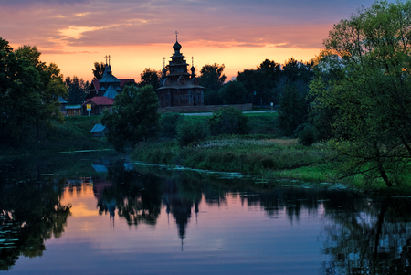 Wooden Orthodox church with reflection in river. The monument of wooden architecture of Russia.Suzdal. Golden Ring of Russiaの写真素材