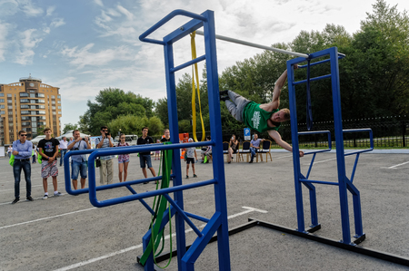 Tyumen, Russia - August 26, 2016: Open Day of Sberbank for children. Street workout showのeditorial素材