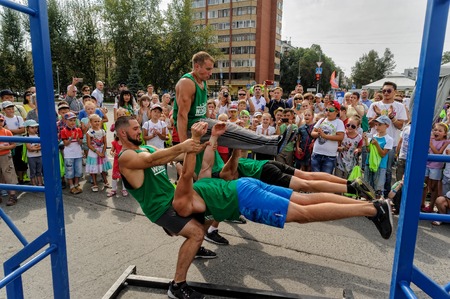 Tyumen, Russia - August 26, 2016: Open Day of Sberbank for children. Street workout showのeditorial素材