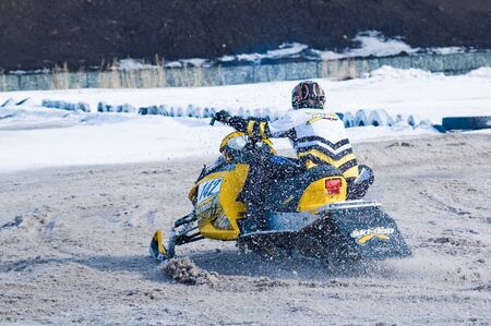 Tyumen, Russia - March 08. 2008: IV stage of personal-team Championship of Ural Federal district in over-snow cross-country. Snowmobile rider on sport trackのeditorial素材