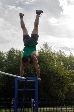 Tyumen, Russia - August 26, 2016: Open Day of Sberbank for children. Street workout showのeditorial素材