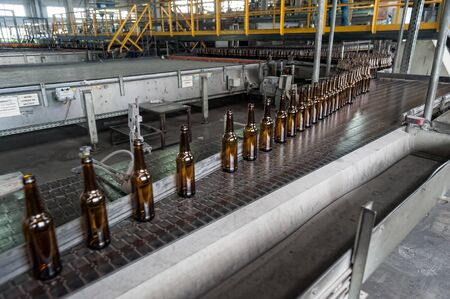 Bogandinskiy, Russia - April 20, 2018: Stekloteh factory on bottles production. Many bottles on conveyor beltのeditorial素材