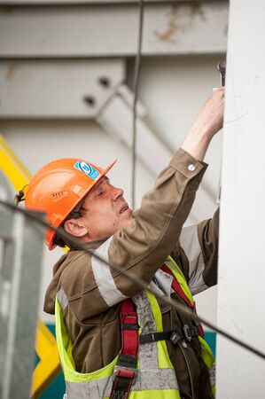 Tobolsk, Russia - May 29. 2018: Sibur company. Construction of plant on processing of hydrocarbons. Worker on construction siteのeditorial素材