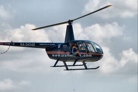 Nizhniy Tagil, Russia - July 12. 2008: RAE exhibition. Robinson R44 Raven shows flying opportunitiesのeditorial素材